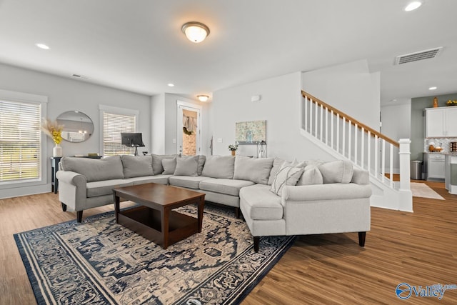 9130 Monteagle Blvd, Owens Cross Roads, AL 35763 - living area featuring wood finished floors, stairway, and recessed lighting