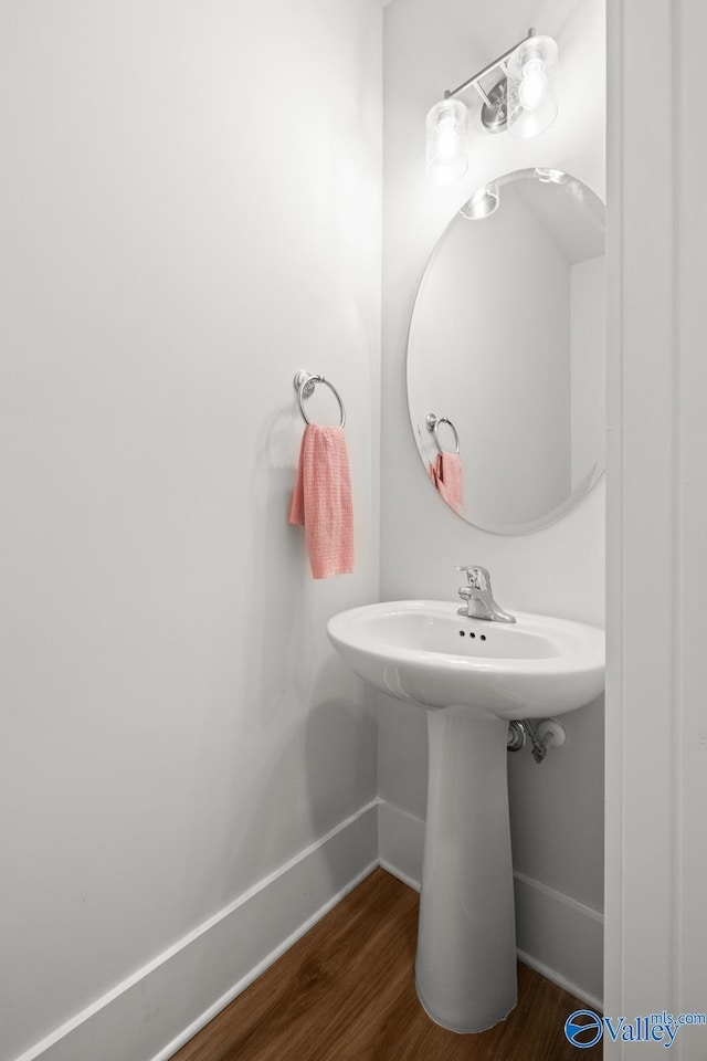 9130 Monteagle Blvd, Owens Cross Roads, AL 35763 - bathroom featuring baseboards, wood finished floors, and a sink