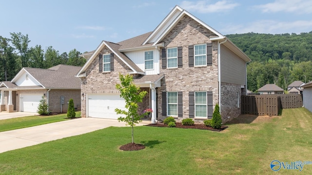 9130 Monteagle Blvd, Owens Cross Roads, AL 35763 - view of front of property with driveway, brick siding, and a garage