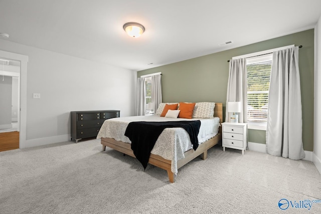 9130 Monteagle Blvd, Owens Cross Roads, AL 35763 - bedroom featuring multiple windows, carpet flooring, and baseboards
