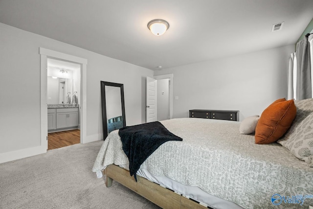 9130 Monteagle Blvd, Owens Cross Roads, AL 35763 - bedroom featuring carpet floors, baseboards, and ensuite bath