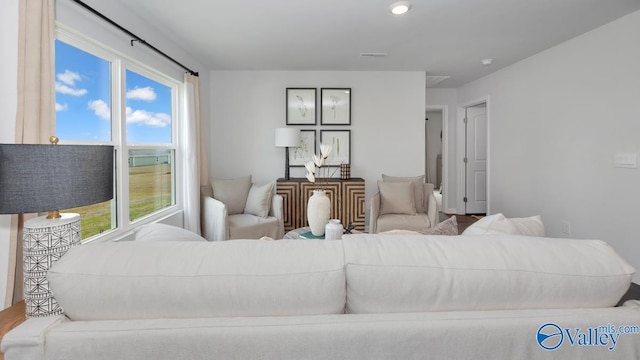 living room featuring wood finished floors and visible vents