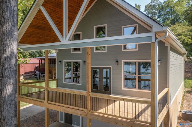 back of property featuring french doors and central AC unit