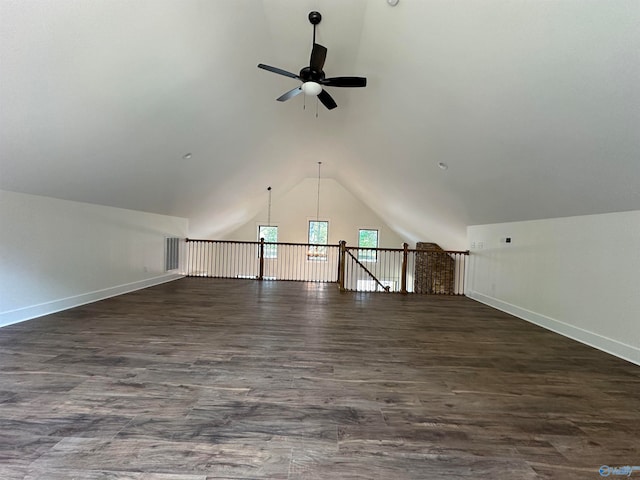 additional living space featuring ceiling fan, lofted ceiling, and dark hardwood / wood-style flooring