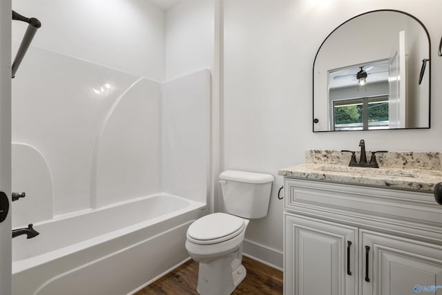 665 County Road 585, Cedar Bluff, AL 35959 - full bath with vanity, toilet, wood finished floors, tub / shower combination, and baseboards