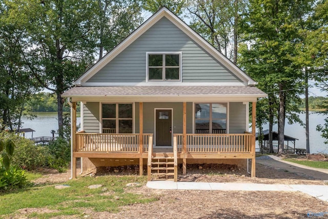 bungalow-style house with a water view and covered porch