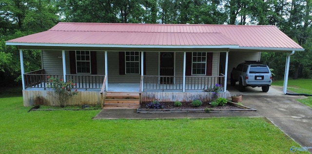 3185 Reeves Rd, Hokes Bluff, AL 35903 - view of front of property featuring driveway, a porch, a front lawn, metal roof, and an attached carport