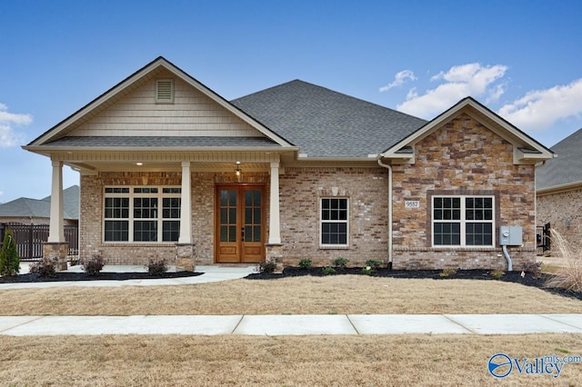 craftsman-style home with french doors