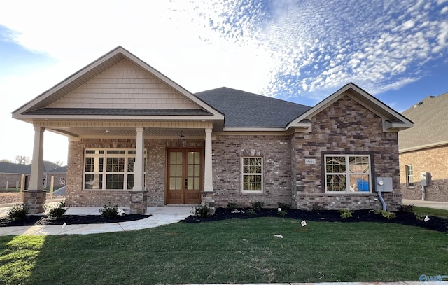 craftsman house featuring a front yard and covered porch