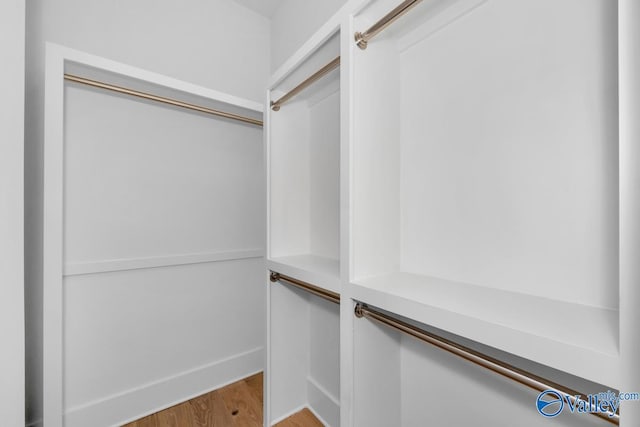 spacious closet featuring light wood-type flooring