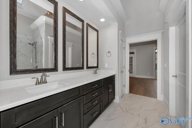 bathroom featuring vanity, ornamental molding, and walk in shower