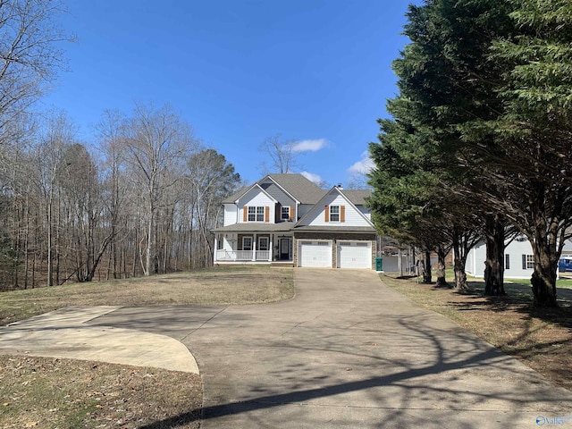 view of front of property featuring a garage and covered porch