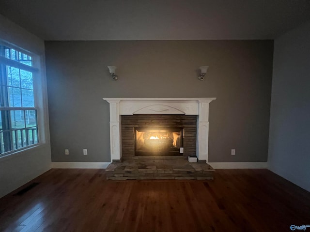 unfurnished living room featuring hardwood / wood-style floors