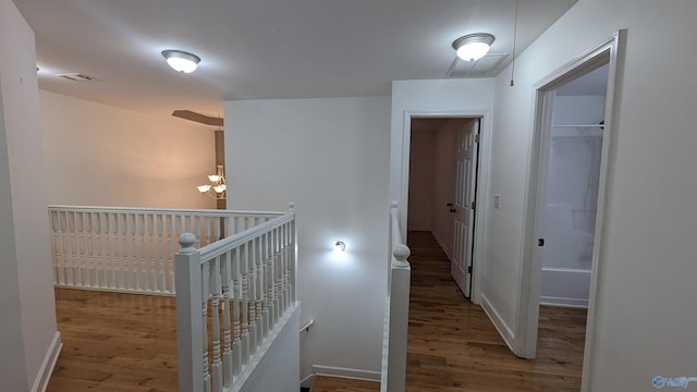 corridor with wood-type flooring