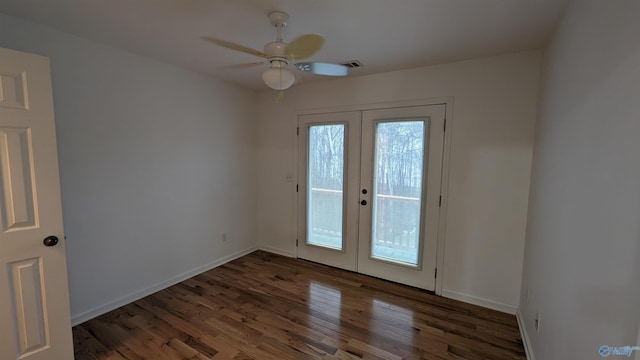 doorway with dark wood-type flooring, french doors, and ceiling fan