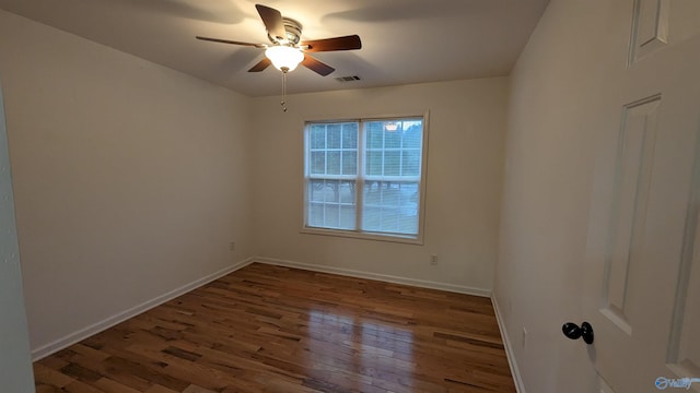 spare room with hardwood / wood-style flooring and ceiling fan