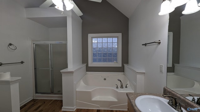 bathroom with lofted ceiling, vanity, ceiling fan, hardwood / wood-style floors, and separate shower and tub