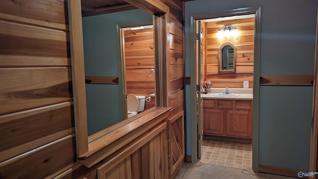 bathroom featuring tile patterned floors, toilet, and vanity