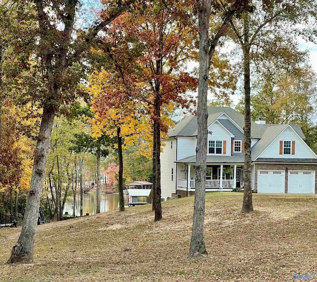 view of front of property featuring a garage and covered porch