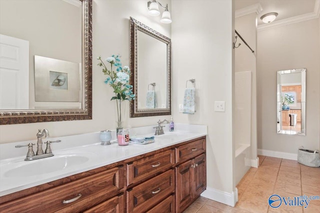 bathroom with vanity, crown molding, and tile patterned flooring