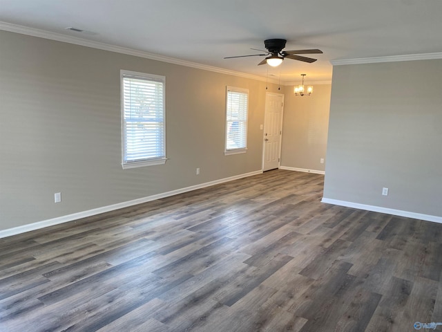 empty room featuring ornamental molding, baseboards, dark wood-style floors, and ceiling fan with notable chandelier