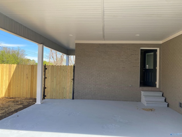 view of patio featuring fence