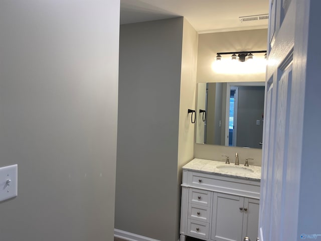 bathroom featuring vanity and visible vents