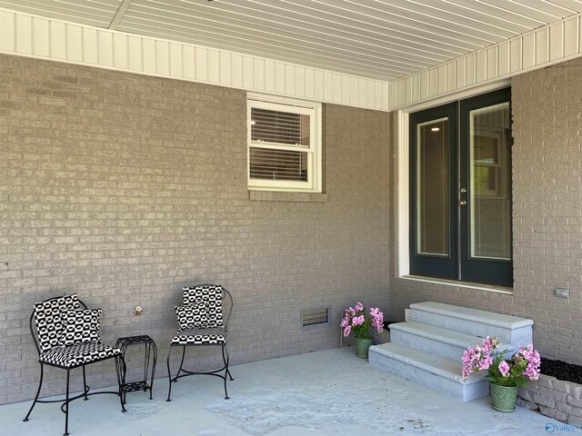 view of patio / terrace with entry steps and visible vents