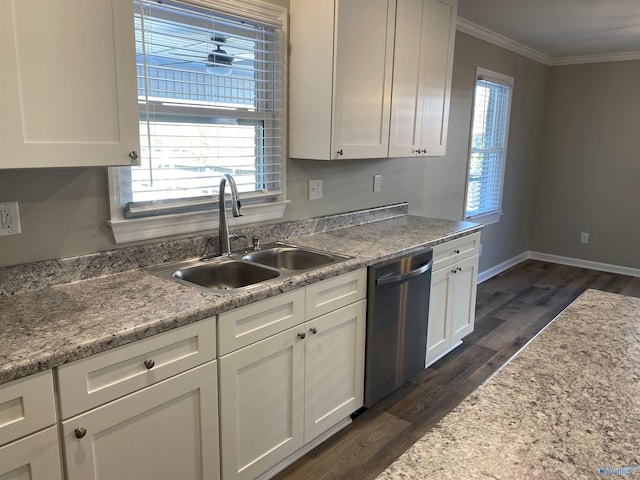 kitchen with ornamental molding, white cabinets, dark wood finished floors, stainless steel dishwasher, and a sink