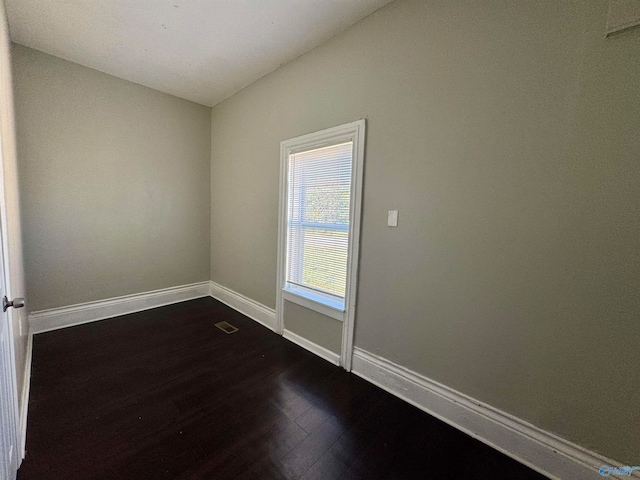 empty room with wood-type flooring