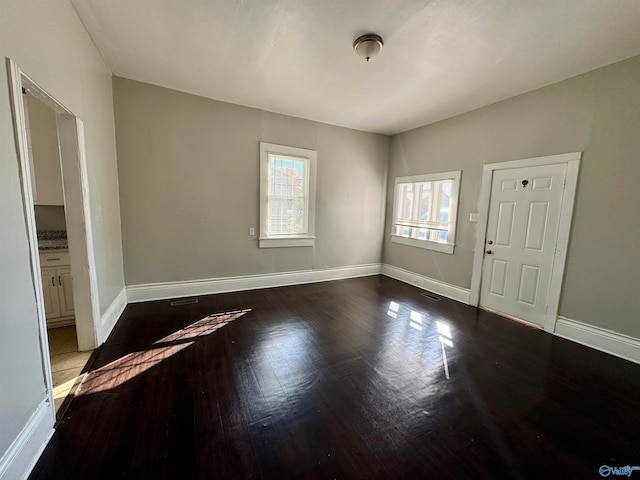 interior space with dark wood-type flooring