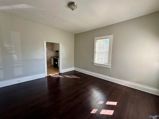 unfurnished room with light wood-type flooring