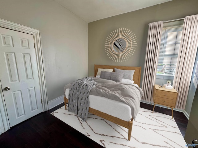 bedroom featuring dark wood-type flooring