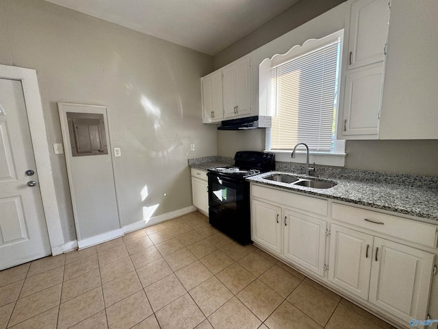 kitchen featuring white cabinetry, sink, light stone countertops, light tile patterned floors, and black electric range