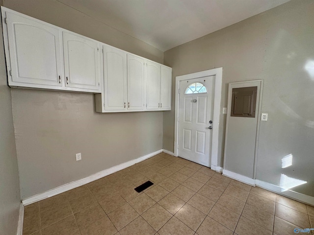 entrance foyer with light tile patterned floors