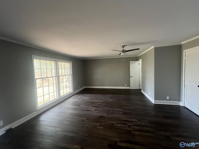 spare room featuring dark hardwood / wood-style floors, ceiling fan, and crown molding