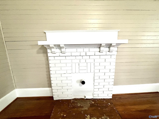 753 Walnut St, Gadsden, AL 35901 - laundry view of baseboards and wood finished floors