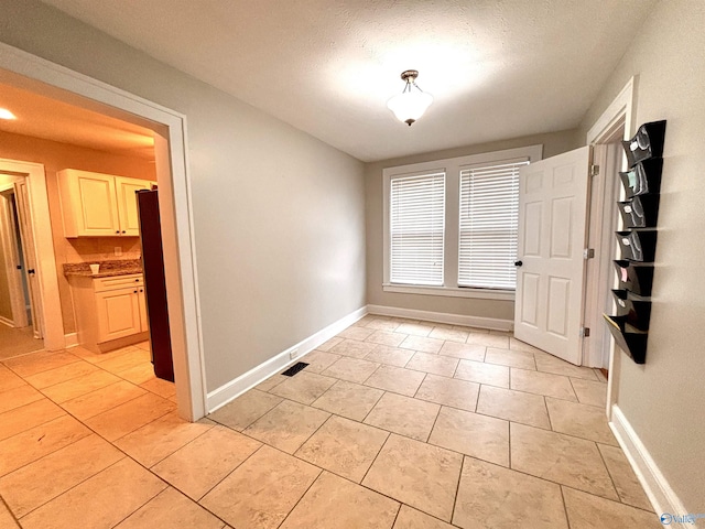 753 Walnut St, Gadsden, AL 35901 - spare room with baseboards and light tile patterned floors