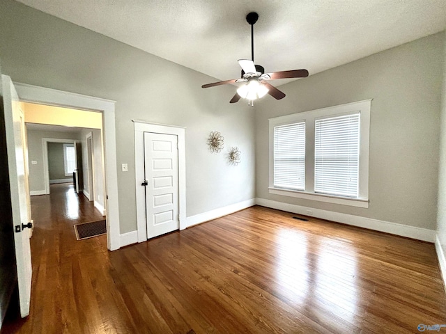 753 Walnut St, Gadsden, AL 35901 - empty room featuring a ceiling fan, wood finished floors, and baseboards