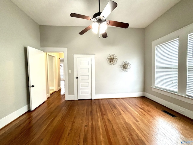 753 Walnut St, Gadsden, AL 35901 - unfurnished bedroom with baseboards, wood finished floors, ceiling fan, and lofted ceiling