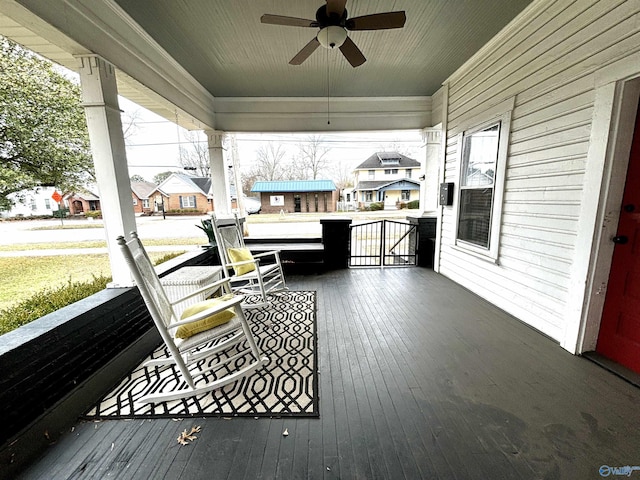 753 Walnut St, Gadsden, AL 35901 - wooden porch with ceiling fan and a residential view