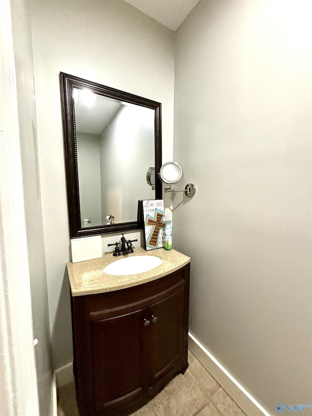 753 Walnut St, Gadsden, AL 35901 - bathroom with vanity, baseboards, and tile patterned floors
