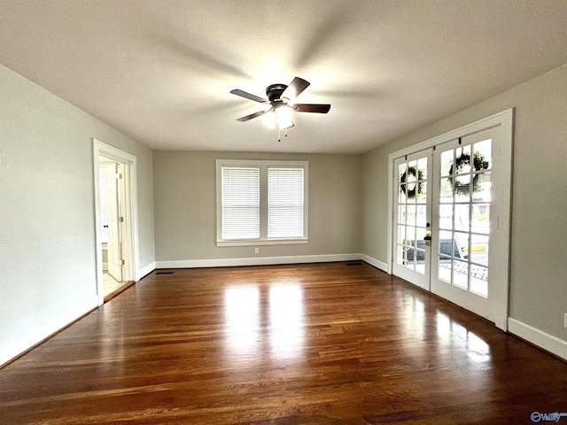 753 Walnut St, Gadsden, AL 35901 - empty room featuring french doors, wood finished floors, a ceiling fan, and baseboards