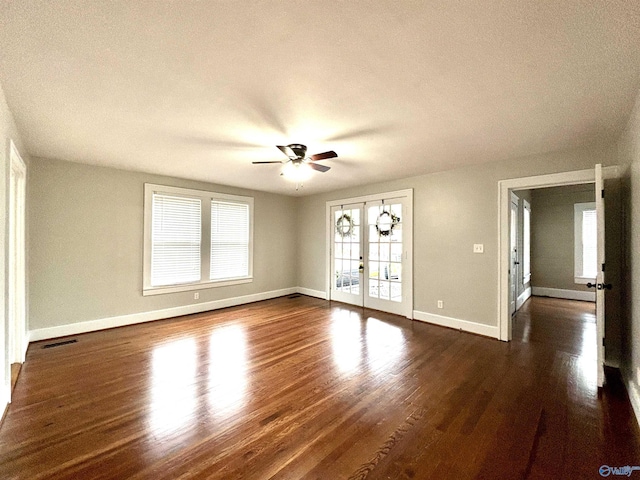 753 Walnut St, Gadsden, AL 35901 - unfurnished living room featuring ceiling fan, baseboards, dark wood-style flooring, and a textured ceiling