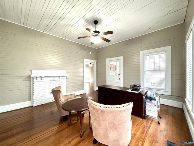 753 Walnut St, Gadsden, AL 35901 - office area featuring a ceiling fan, wood finished floors, baseboards, and wooden walls
