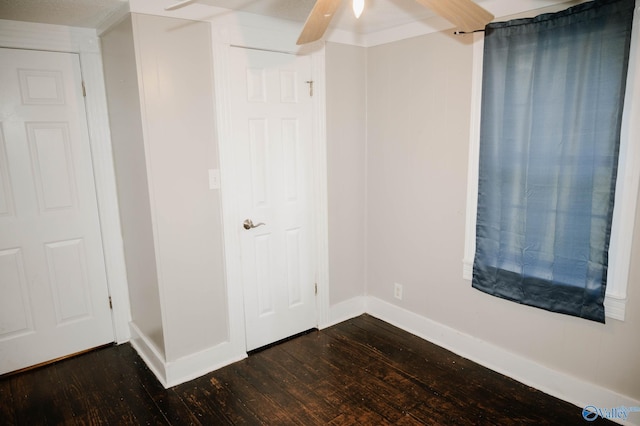 509 2nd Ave SW, Arab, AL 35016 - unfurnished bedroom with dark wood-style floors and ceiling fan