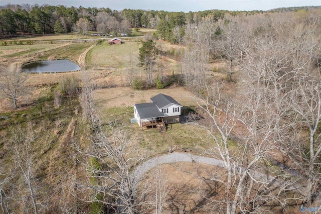 bird's eye view featuring a wooded view, a water view, and a rural view
