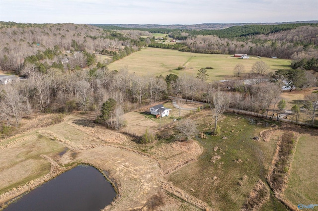 aerial view with a water view, a rural view, and a view of trees