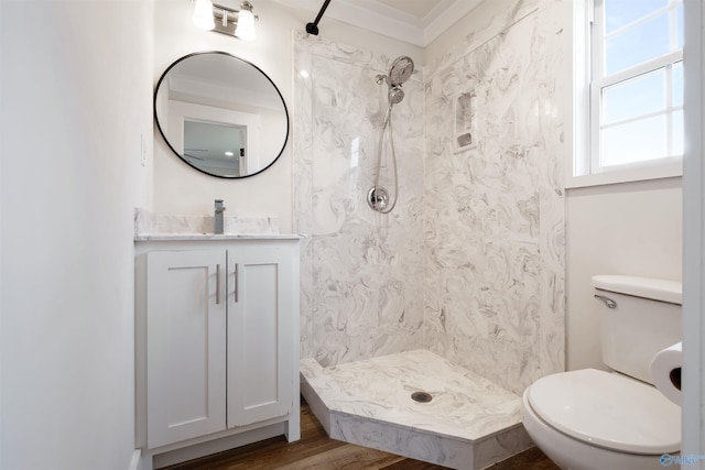 full bathroom with vanity, toilet, and a shower stall