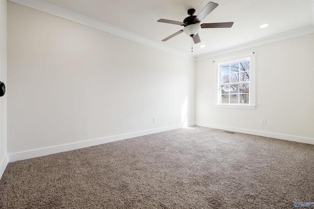 spare room with carpet, crown molding, baseboards, recessed lighting, and a ceiling fan